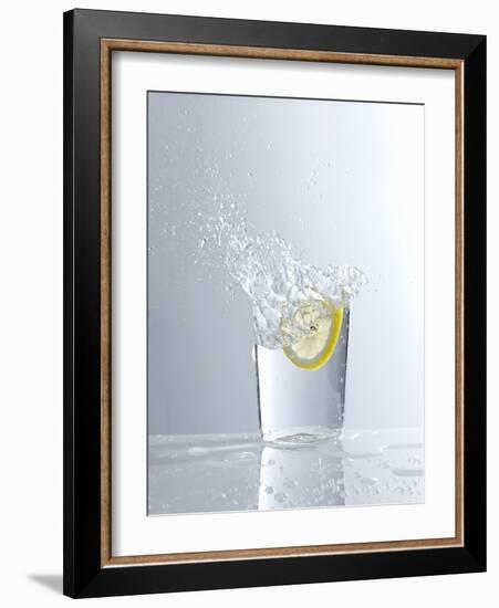 Water Splashing Out of a Glass-Karl Newedel-Framed Photographic Print