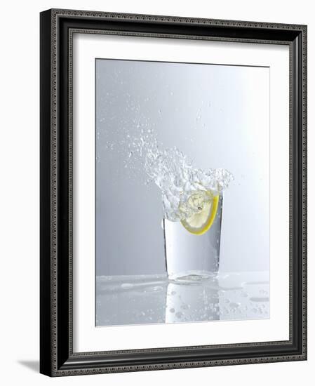 Water Splashing Out of a Glass-Karl Newedel-Framed Photographic Print