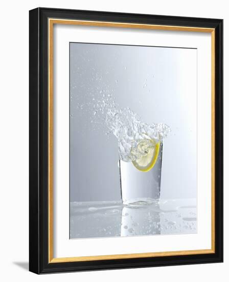 Water Splashing Out of a Glass-Karl Newedel-Framed Photographic Print