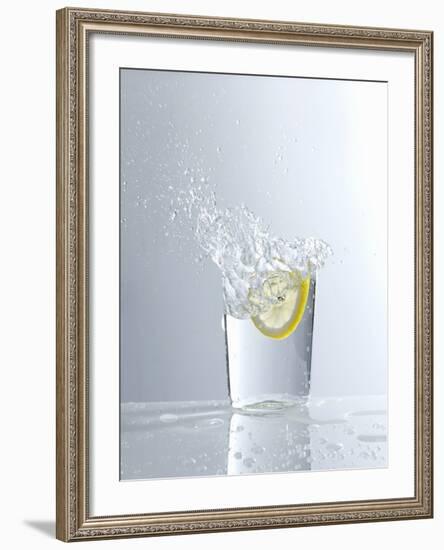 Water Splashing Out of a Glass-Karl Newedel-Framed Photographic Print