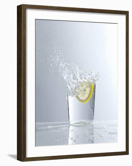 Water Splashing Out of a Glass-Karl Newedel-Framed Photographic Print