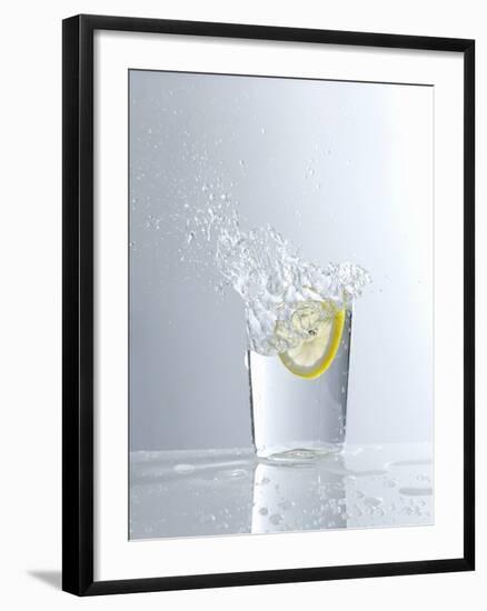 Water Splashing Out of a Glass-Karl Newedel-Framed Photographic Print