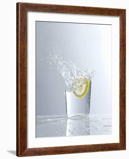 Water Splashing Out of a Glass-Karl Newedel-Framed Photographic Print