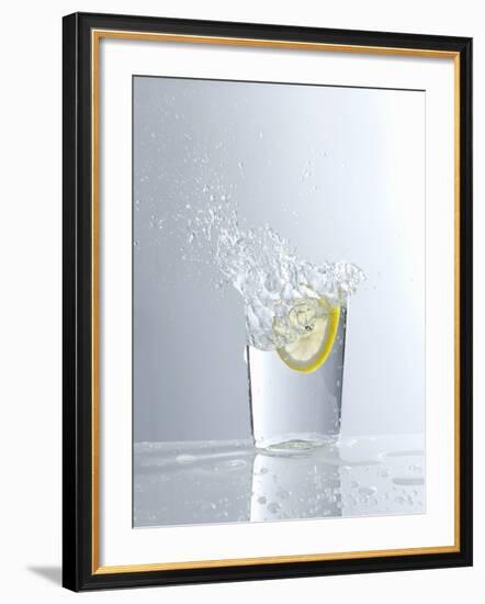 Water Splashing Out of a Glass-Karl Newedel-Framed Photographic Print