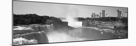 Waterfall with City Skyline in the Background, Niagara Falls, Ontario, Canada-null-Mounted Photographic Print