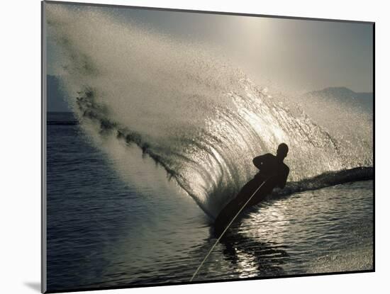 Waterskier Silhouetted with Sun Shining Through Water-null-Mounted Photographic Print