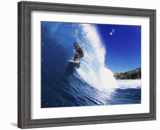 Wave Curling Up Over Surfer-null-Framed Photographic Print