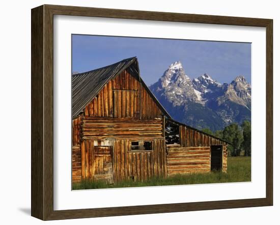 Weathered Wooden Barn Along Mormon Row with the Grand Tetons in Distance, Grand Teton National Park-Dennis Flaherty-Framed Photographic Print