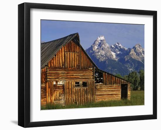 Weathered Wooden Barn Along Mormon Row with the Grand Tetons in Distance, Grand Teton National Park-Dennis Flaherty-Framed Photographic Print