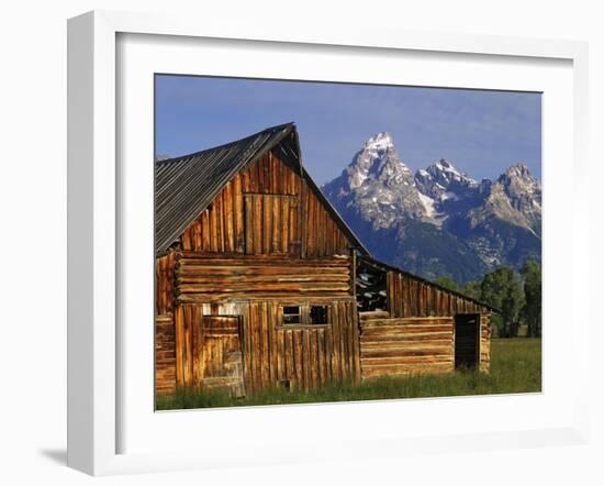 Weathered Wooden Barn Along Mormon Row with the Grand Tetons in Distance, Grand Teton National Park-Dennis Flaherty-Framed Photographic Print