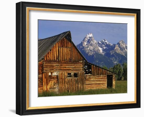 Weathered Wooden Barn Along Mormon Row with the Grand Tetons in Distance, Grand Teton National Park-Dennis Flaherty-Framed Photographic Print