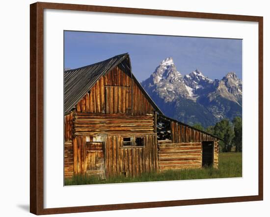 Weathered Wooden Barn Along Mormon Row with the Grand Tetons in Distance, Grand Teton National Park-Dennis Flaherty-Framed Photographic Print