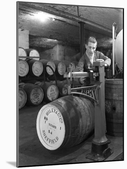 Weighing Barrels of Blended Whisky at Wiley and Co, Sheffield, South Yorkshire, 1960-Michael Walters-Mounted Photographic Print