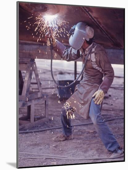 Welder at the Promecan Shipyard, Lima, Peru-Bill Ray-Mounted Photographic Print