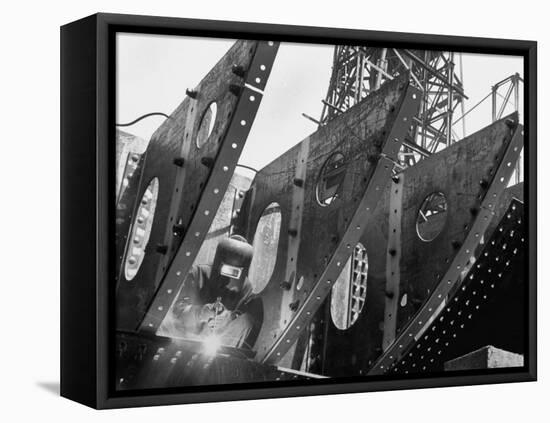 Welder Securing Steel Structure While Working on Hull of a Ship, Bethlehem Shipbuilding Drydock-Margaret Bourke-White-Framed Premier Image Canvas