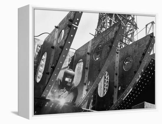 Welder Securing Steel Structure While Working on Hull of a Ship, Bethlehem Shipbuilding Drydock-Margaret Bourke-White-Framed Premier Image Canvas