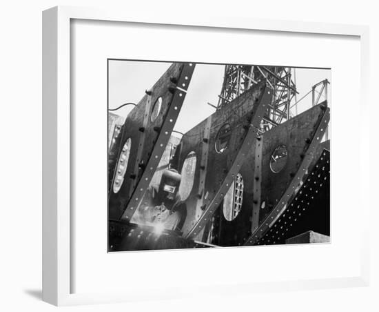 Welder Securing Steel Structure While Working on Hull of a Ship, Bethlehem Shipbuilding Drydock-Margaret Bourke-White-Framed Premium Photographic Print