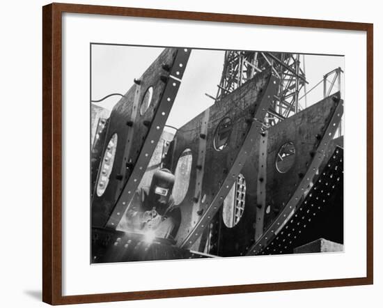 Welder Securing Steel Structure While Working on Hull of a Ship, Bethlehem Shipbuilding Drydock-Margaret Bourke-White-Framed Premium Photographic Print