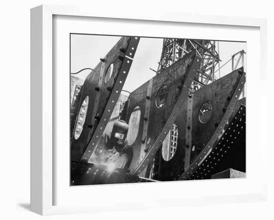 Welder Securing Steel Structure While Working on Hull of a Ship, Bethlehem Shipbuilding Drydock-Margaret Bourke-White-Framed Photographic Print