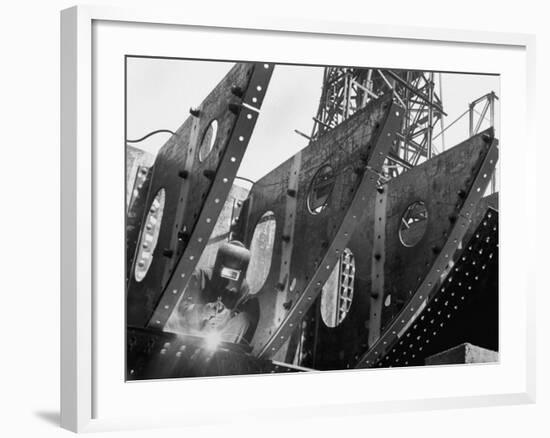 Welder Securing Steel Structure While Working on Hull of a Ship, Bethlehem Shipbuilding Drydock-Margaret Bourke-White-Framed Photographic Print