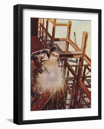 Welder Uses an Electric Arc- Welding Tool to Join the Metal Parts of a Steel Structure-null-Framed Photographic Print