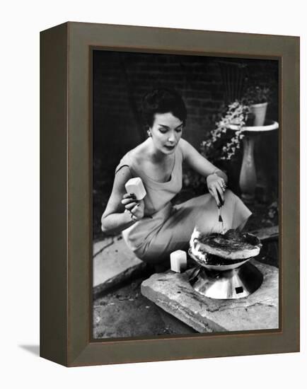 Well-Dressed Woman Cooking a Large Steak on the Aluminum Disposable Barbecue Grill-Peter Stackpole-Framed Premier Image Canvas