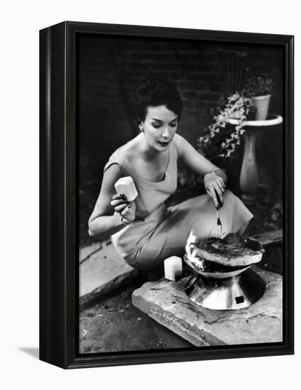 Well-Dressed Woman Cooking a Large Steak on the Aluminum Disposable Barbecue Grill-Peter Stackpole-Framed Premier Image Canvas