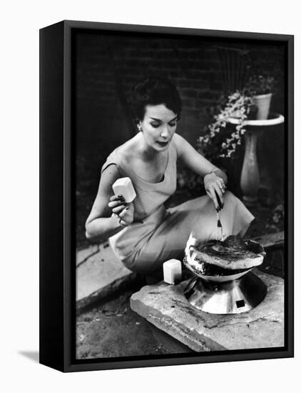 Well-Dressed Woman Cooking a Large Steak on the Aluminum Disposable Barbecue Grill-Peter Stackpole-Framed Premier Image Canvas