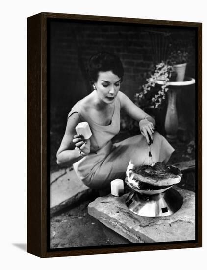 Well-Dressed Woman Cooking a Large Steak on the Aluminum Disposable Barbecue Grill-Peter Stackpole-Framed Premier Image Canvas