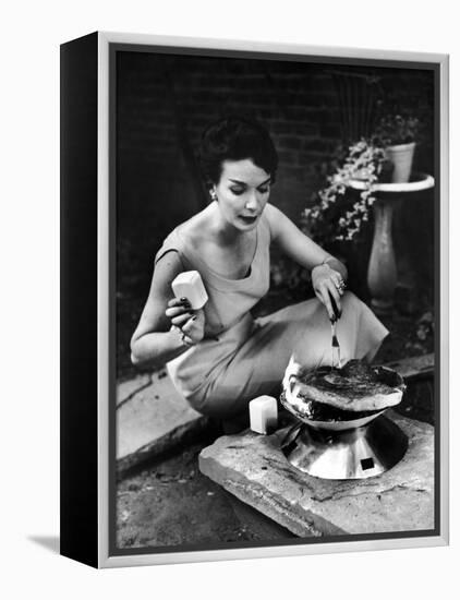 Well-Dressed Woman Cooking a Large Steak on the Aluminum Disposable Barbecue Grill-Peter Stackpole-Framed Premier Image Canvas