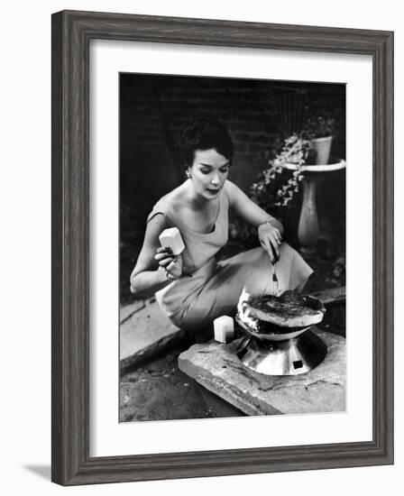 Well-Dressed Woman Cooking a Large Steak on the Aluminum Disposable Barbecue Grill-Peter Stackpole-Framed Photographic Print