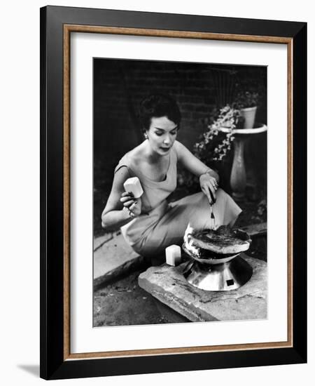 Well-Dressed Woman Cooking a Large Steak on the Aluminum Disposable Barbecue Grill-Peter Stackpole-Framed Photographic Print