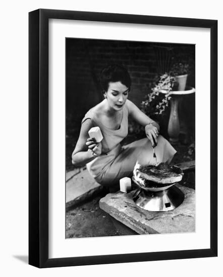 Well-Dressed Woman Cooking a Large Steak on the Aluminum Disposable Barbecue Grill-Peter Stackpole-Framed Photographic Print