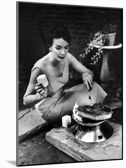 Well-Dressed Woman Cooking a Large Steak on the Aluminum Disposable Barbecue Grill-Peter Stackpole-Mounted Photographic Print