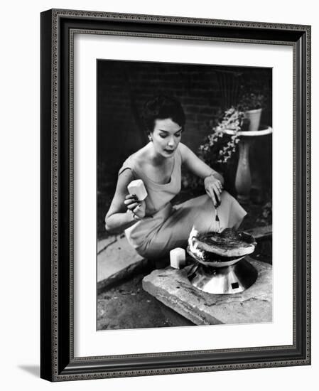 Well-Dressed Woman Cooking a Large Steak on the Aluminum Disposable Barbecue Grill-Peter Stackpole-Framed Photographic Print