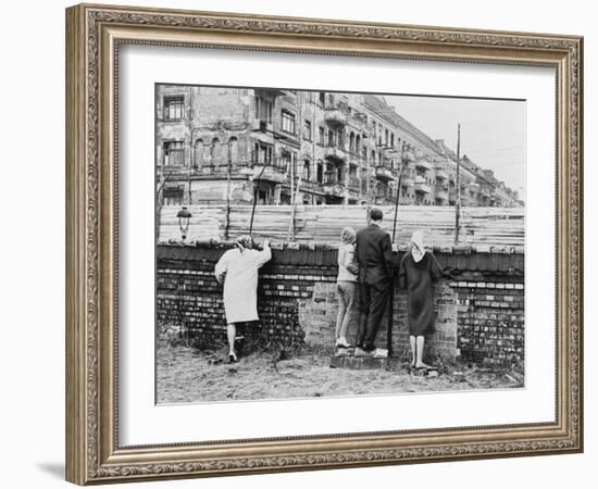 West Berliners Peer over the Infamous Berlin Wall in 1962-null-Framed Photo