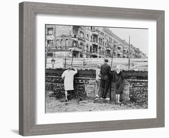 West Berliners Peer over the Infamous Berlin Wall in 1962-null-Framed Photo