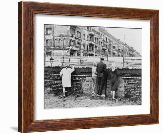 West Berliners Peer over the Infamous Berlin Wall in 1962-null-Framed Photo