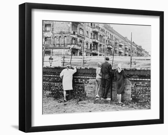 West Berliners Peer over the Infamous Berlin Wall in 1962-null-Framed Photo