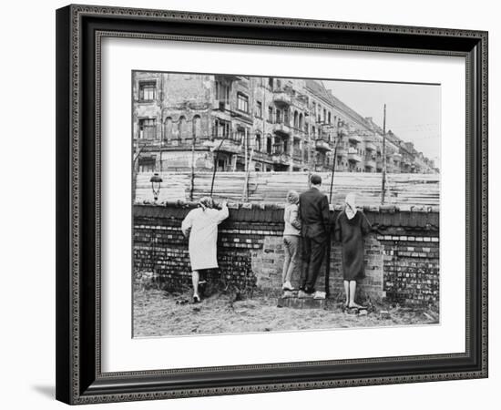 West Berliners Peer over the Infamous Berlin Wall in 1962-null-Framed Photo