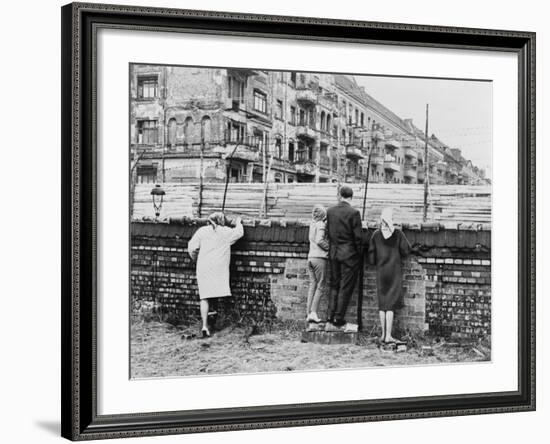 West Berliners Peer over the Infamous Berlin Wall in 1962-null-Framed Photo