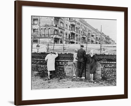 West Berliners Peer over the Infamous Berlin Wall in 1962-null-Framed Photo