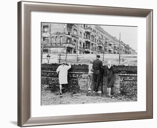 West Berliners Peer over the Infamous Berlin Wall in 1962-null-Framed Photo