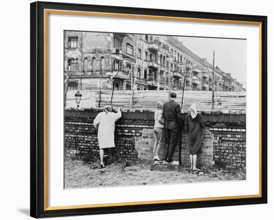 West Berliners Peer over the Infamous Berlin Wall in 1962-null-Framed Photo