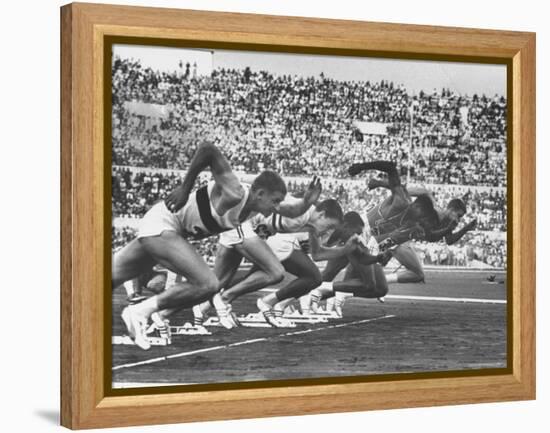 West Germany's Armin Harry, Winner of Men's 100 Meter Dash at Start of Event in Summer Olympics-George Silk-Framed Premier Image Canvas