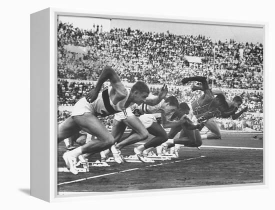 West Germany's Armin Harry, Winner of Men's 100 Meter Dash at Start of Event in Summer Olympics-George Silk-Framed Premier Image Canvas