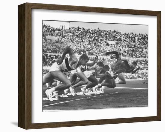 West Germany's Armin Harry, Winner of Men's 100 Meter Dash at Start of Event in Summer Olympics-George Silk-Framed Premium Photographic Print