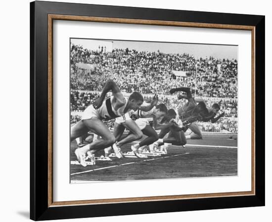 West Germany's Armin Harry, Winner of Men's 100 Meter Dash at Start of Event in Summer Olympics-George Silk-Framed Premium Photographic Print