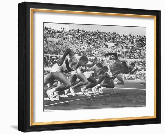 West Germany's Armin Harry, Winner of Men's 100 Meter Dash at Start of Event in Summer Olympics-George Silk-Framed Premium Photographic Print