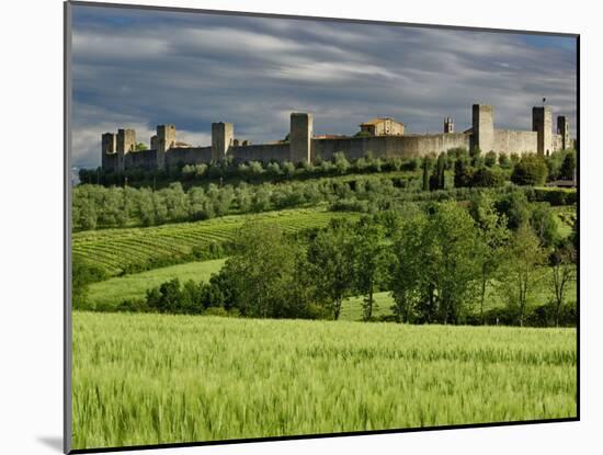 Wheat field and distant Monteriggioni, Siena, Tuscany, Italy-Adam Jones-Mounted Photographic Print
